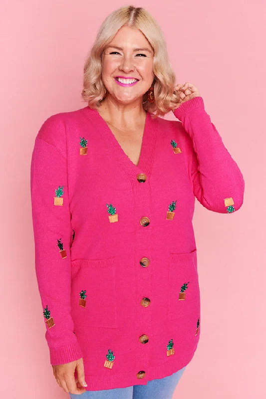 Angela Plants On Pink Cardi